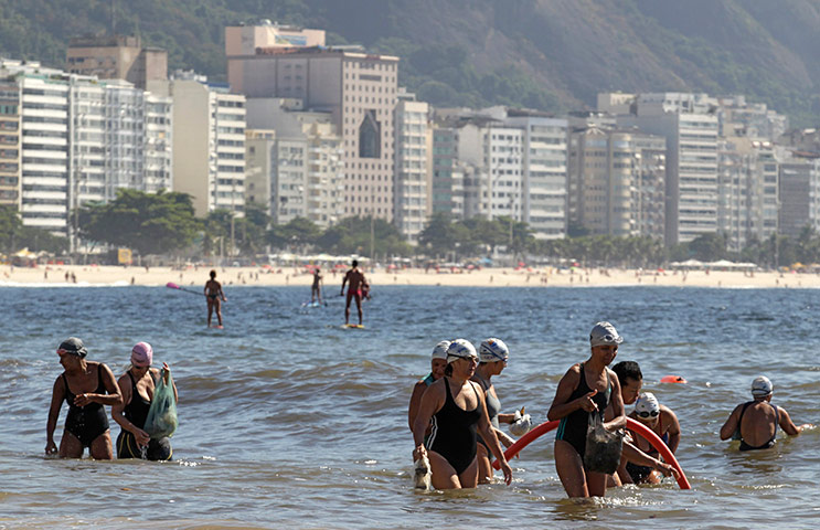 World Water Day: Residents collect garbage on Copacabana beach in Rio de Janeiro