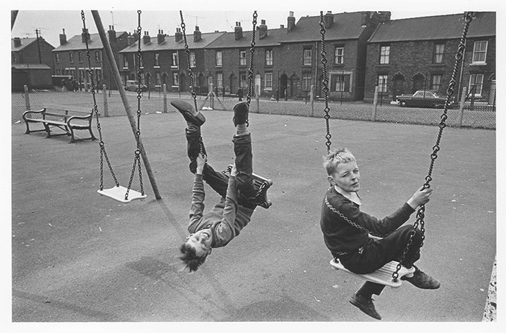 Children's Lives: Boys on Swings by Nick Hedges