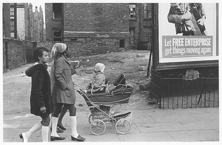 Children's Lives: 3 black women pushing a baby in a pram