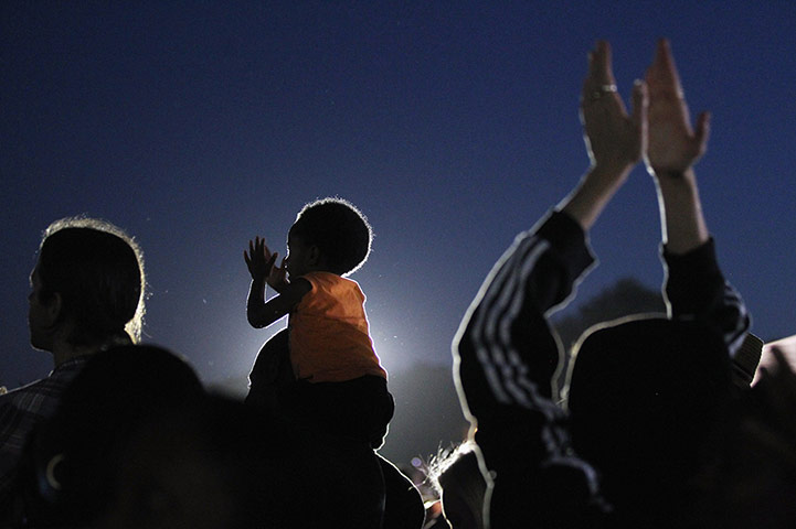 24 Hours: Florida, US: Protesters applaud at a rally for teenager Trayvon Martin