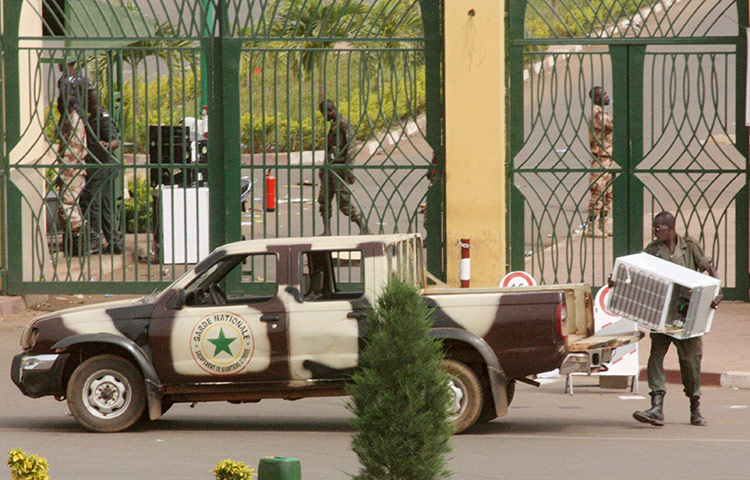 Mali: A soldier loads an appliance 