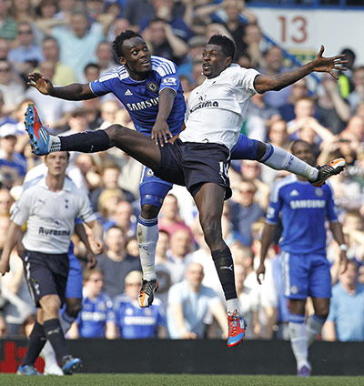 Saturday round-up: Chelsea's Michael Essien vies with Tottenham Hotspur's Emmanuel Adebayor
