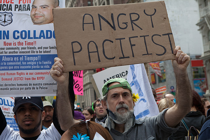 Occupy Wall Street march: Protesters hold more signs as they march