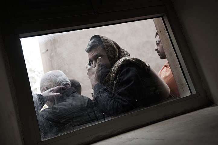 24 hours in pictures: Coptic christians visit the grave of Pope Shenuda
