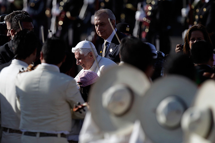 Pope visit to Mexico: Pope Benedict XVI walks past Mariachi musicians