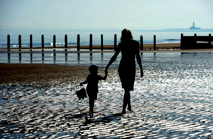 Hot Weather: A young boy plays on the beach in Blyth during th warm weather