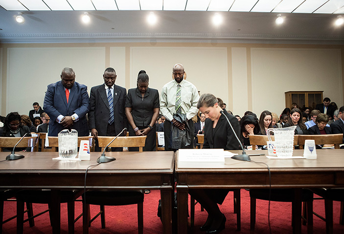 Trayvon Martin march: Parents of Trayvon Martin, bow their heads for a moment of silence