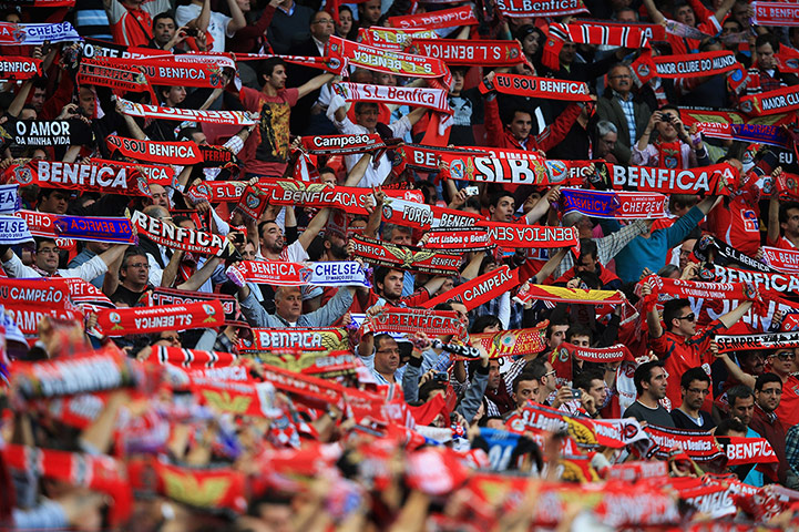 24 hours: Lisbon, Portugal: Benfica fans hold up their scarves