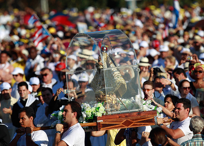 Pope in Cuba: Worshippers carry a statue of the Virgin of Charity of Cobre