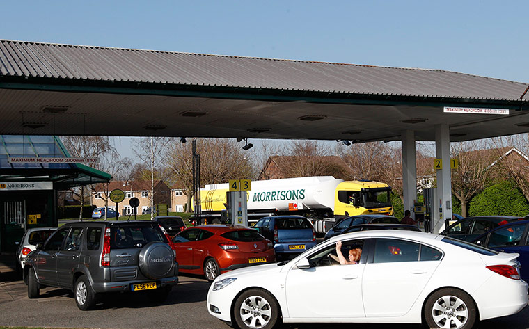 Petrol: Loughborough: A petrol tanker driver makes a delivery