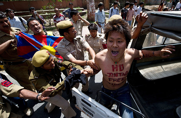 Tibet Protests: A Tibetan exile is detained by Indian police