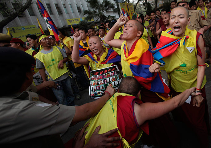 Tibet Protests: Tibetan exiles shout slogans as they scuffle with police during protests