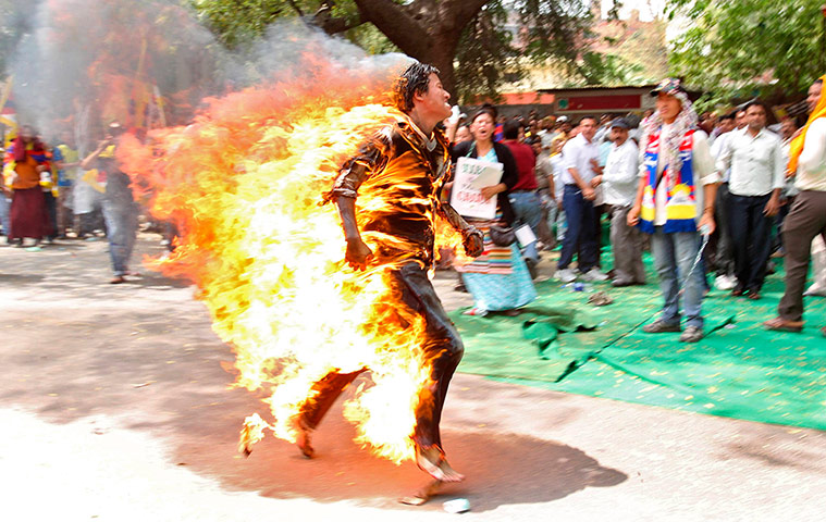 Tibet Protests: Tibetan exile Jampa Yeshi runs after setting himself on fire