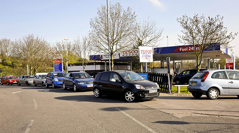 Petrol: Eastville, Bristol: Cars queue at a Tesco petrol station