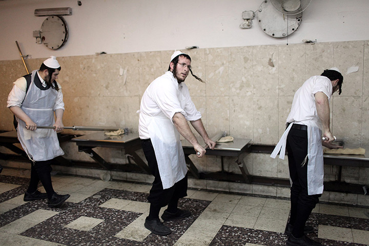 24 hours in pictures: ltra-Orthodox Jews knead dough in a Matzah Bakery