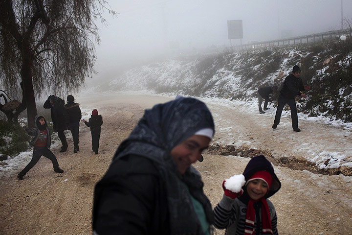 24 Hours: Palestinians play with snow in Bethlehem