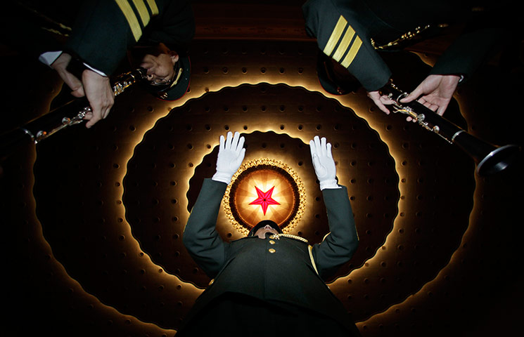 24 Hours: A military band perform at the Great Hall of the People in Beijing