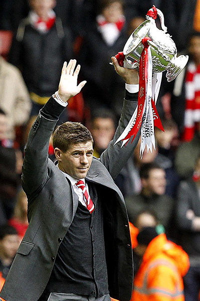 Liverpool v Arsenal: Steven Gerrard shows off the club's first piece of silverware for six years