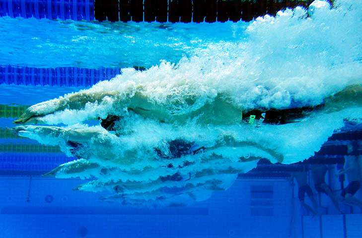 Swimming pt 2: Oh Seungcheol of Korea dives in during a Men's 100m breaststroke heat