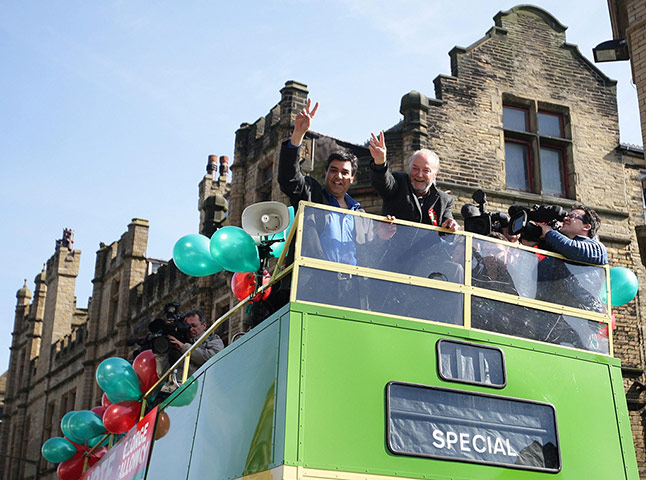George Galloway Wins: MP George Galloway waves to supporters during a bus tour in Bradford