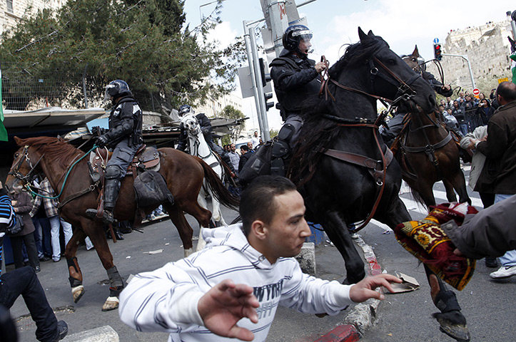 Land Day protests: Israeli mounted policemen move crowds of Palestinian protestors, Jerusalem