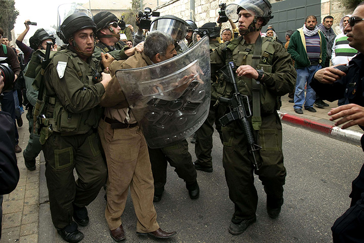 Land Day protests: Palestinian man is arrested by Israeli policemen during a  Jerusalem