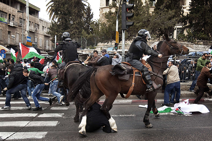 Land Day protests: Israeli mounted policeman disperse Palestinian protesters in east Jerusalem