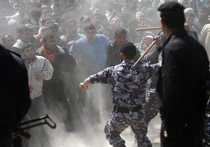 Land Day protests: Members of the Hamas security forces restrain Palestinian protesters