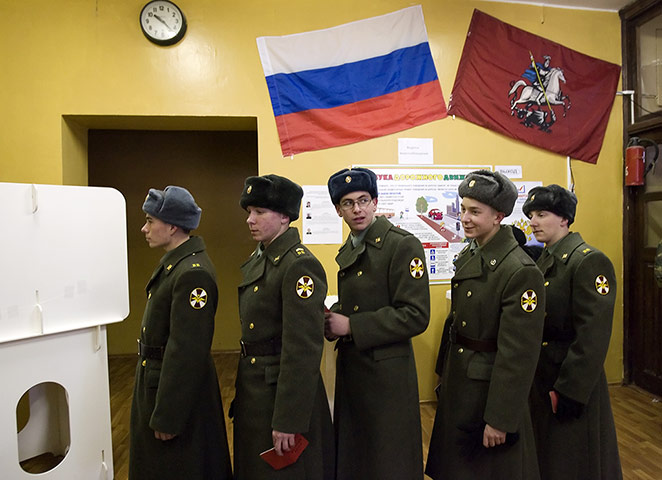 Russian election: Moscow: Soldiers wait for their turn to vote