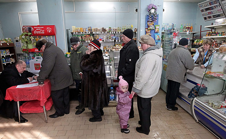 Russian election: Podolsk, Moscow Oblast: People receive their ballot papers