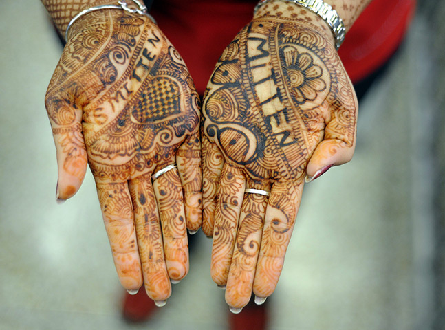 24 hours in pictures: Snellville, US: Ruth Malhotra shows off her henna-dyed hands