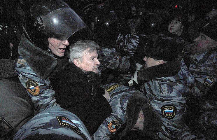 Putin protest: Police officers detain the Other Russia movement leader Eduard Limonov 
