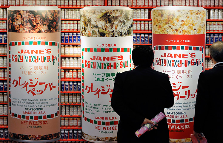 24 hours: Chiba city, Japan: Visitors look at an advertisement for special seasoning