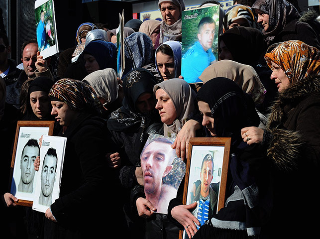 Women protesting: Ethnic Albanian women hold pictures 