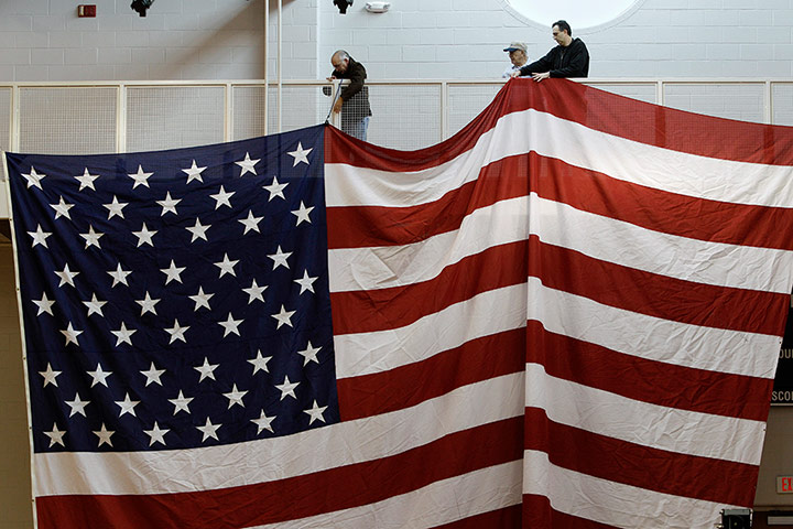 24 Hours: Steubenville, Ohio: Workers hang an American Flag