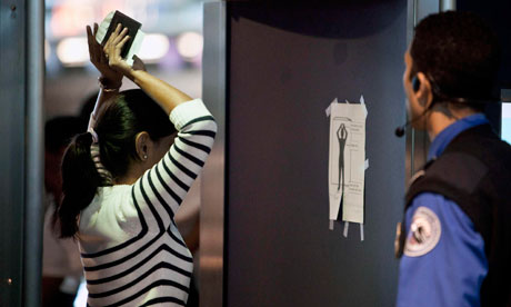 A traveller is screened at John F Kennedy airport in New York