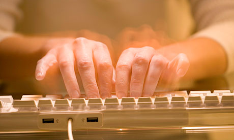 Man typing on computer keyboard