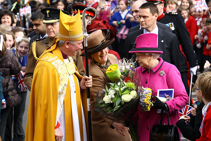Royals in Leicester: Queen Elizabeth II is given some flowers as she visits Leicester Cathedral 
