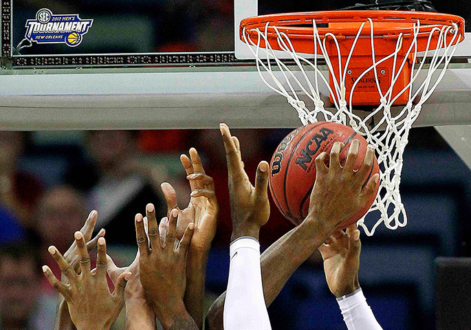 Best of the week in sport: Auburn Tigers and Mississippi Rebels players jump for a rebound 