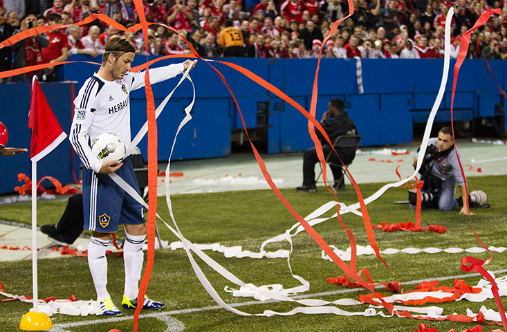 Best of the week in sport: LA Galaxy's David Beckham prepares to take a corner kick against Toronto FC