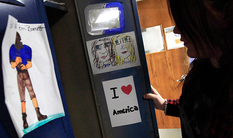 From the agencies: Chris Fabian stops by her locker between classes 