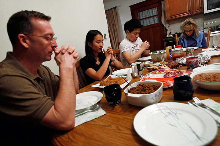 From the agencies: Kerry and Jon Wold sit next to their foreign exchange students