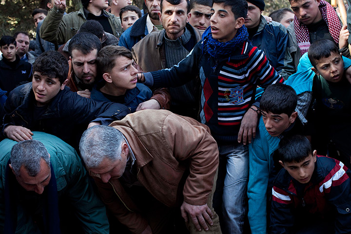 24 hours in pictures: Idlib, Syria: Mourners attend the funeral for Abdulaziz Abu Ahmed Khrer