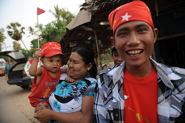 Burma elections: Supporters wait on the side of a road in Kawhmu