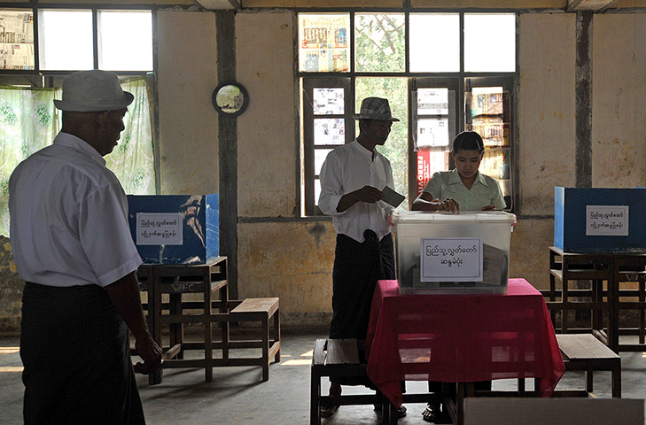 Burma elections: Voters cast their ballots at a polling station in Kawhmu