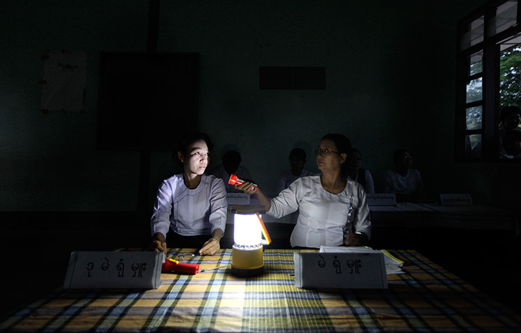 24 hours: Wah Thin Kha, Burma: Election officials work inside a dark polling station