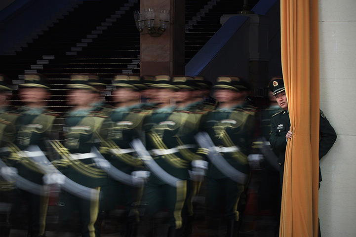 24 hours: Beijing, China: Honour guards parade before a welcoming ceremony