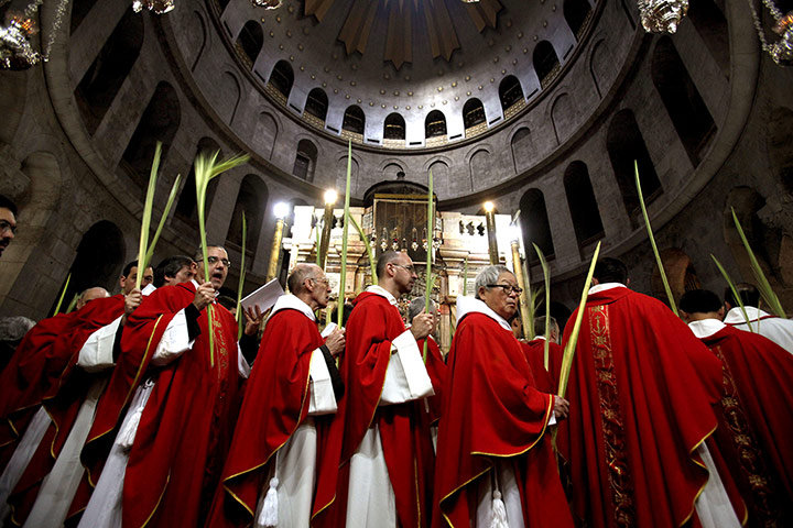 Palm Sunday: Clergy circle the aedicule during the Palm Sunday procession in Jerusalem