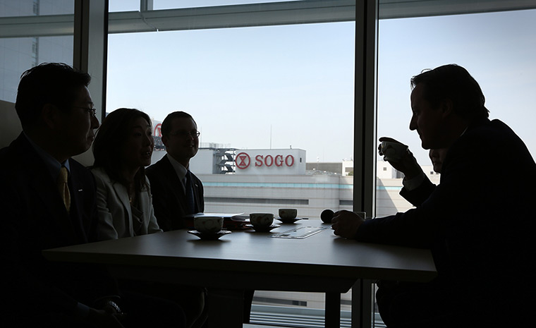 Cameron in Japan: Prime Minister David Cameron takes tea with employees at Nissan HQ