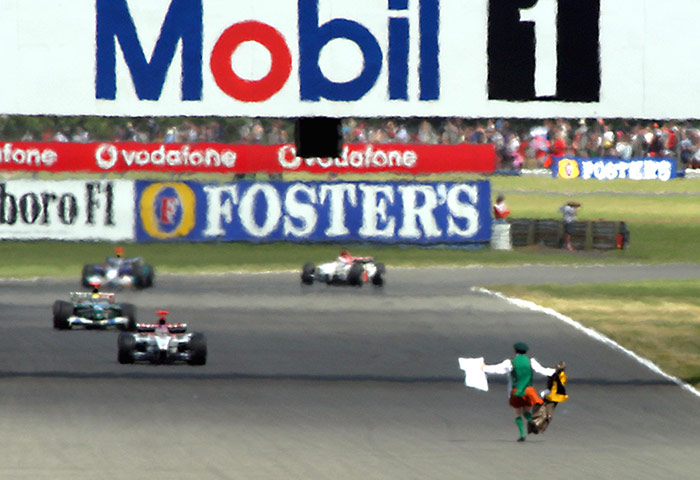 protests: Potestor Cornelius Horan running onto the track at Silverstone